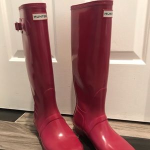Tall pink Hunter rain boots